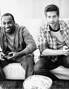 Two Guys Playing Video Games at The One Apartments for Rent Jersey City